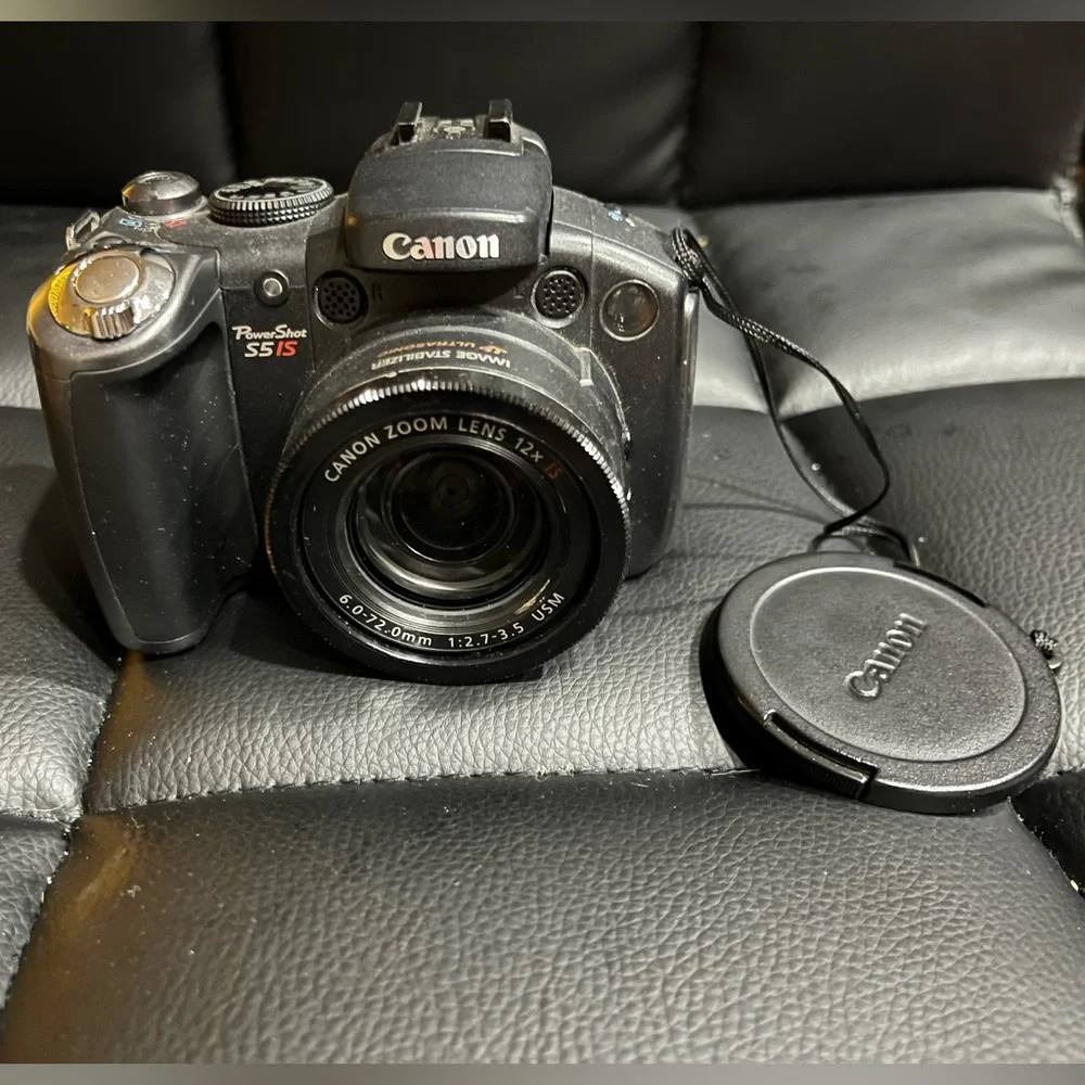 canon powershot s5 is with 2 lens covers and bag